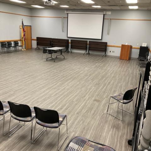 Large meeting room with table and chairs