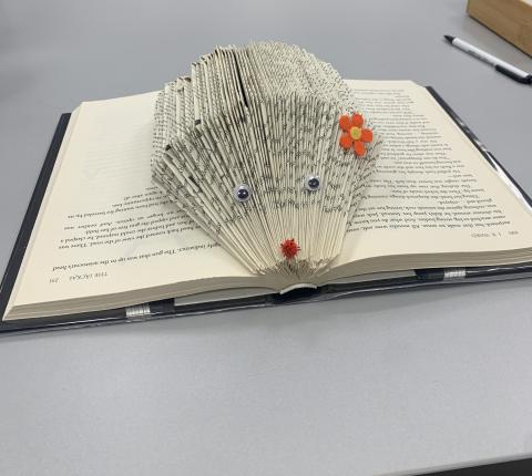 Craft of a book folded into a hedgehog shape. 