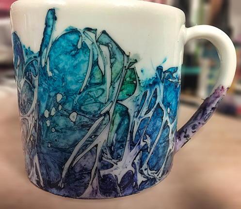 A mug with a design on it.